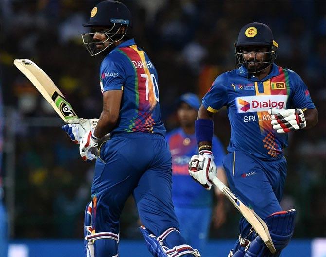 Kusal Perera, right, and Danushka Gunathilaka run between the wickets