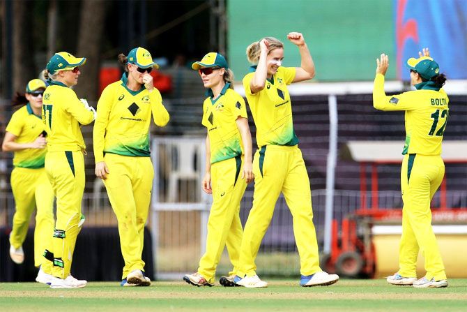 Australia players celebrate an Indian wicket