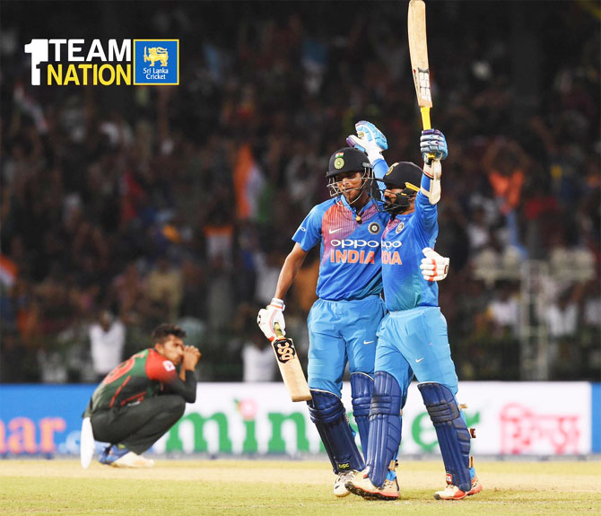 Dinesh Karthik is congratulated by Washington Sundar after he hit the match-winning six off the last ball of the match