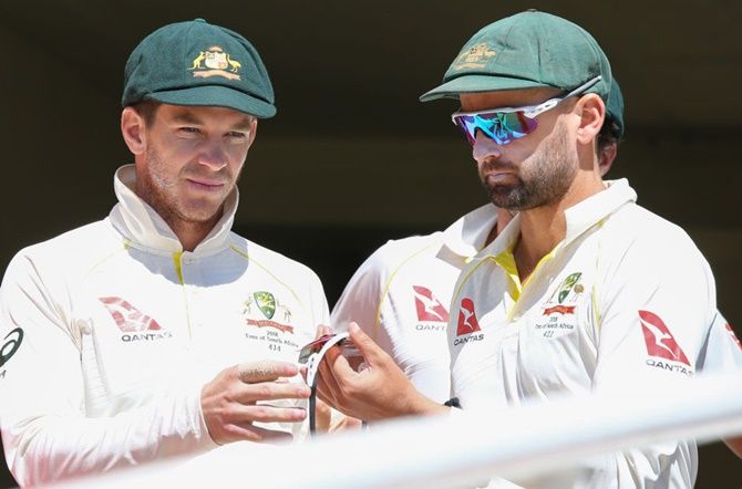 Tim Paine, left, with Nathan Lyon