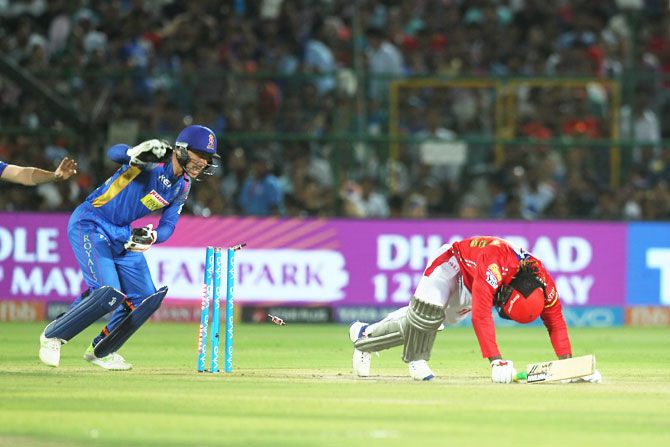 Kings XI Punjab's Chris Gayle is stumped by Rajasthan Royals' Jos Buttler off the bowling of K Gowtham