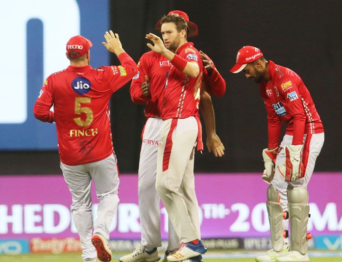 Kings XI Punjab players celebrate the wicket of Mumbai Indians' Evin Lewis