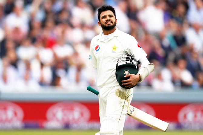 Pakistan's Azhar Ali looks dejected as he walks off after losing his wicket 