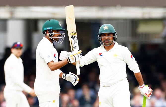 Pakistan's Babar Azam (left) celebrates with Sarfraz Ahmed after reaching a half century