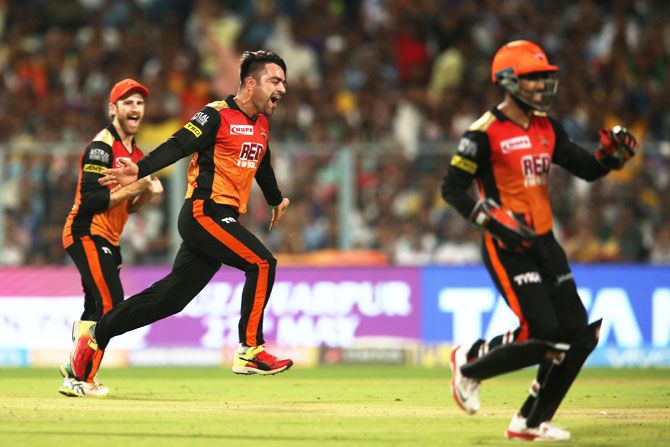 Sunrisers Hyderabad's Rashid Khan celebrates after taking the wicket of Kolkata Knight Riders's Andre Russell 