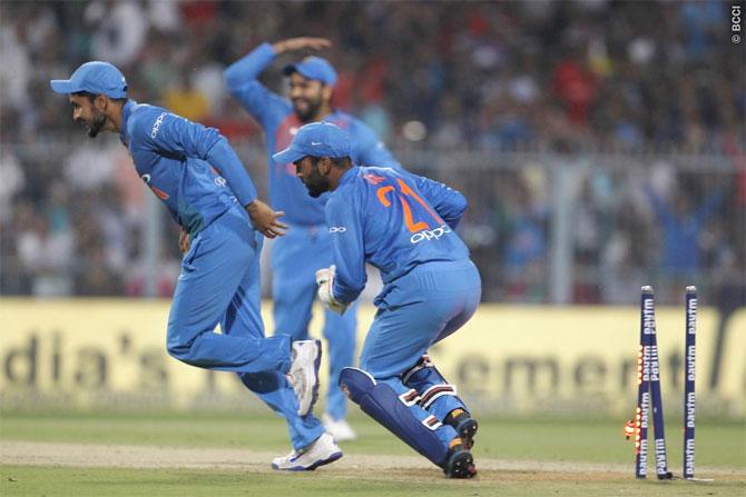 Manish Pandey and Dinesh Karthik celebrate after dismissing Shai Hope