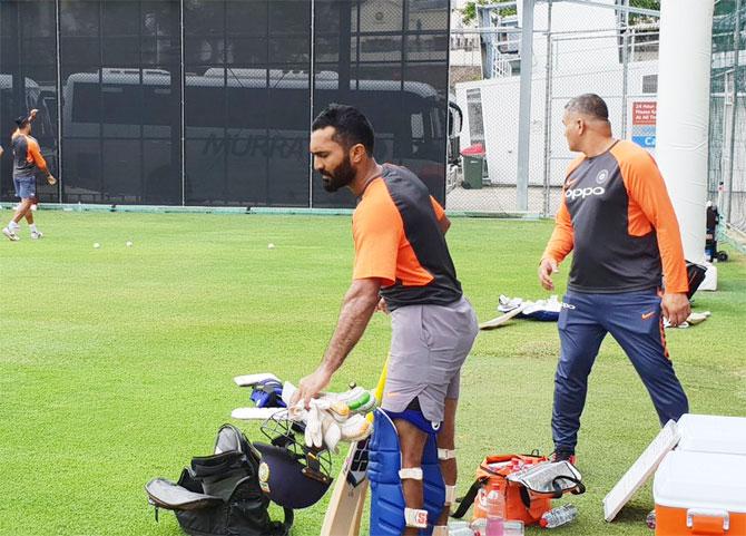 Dinesh Kartjhik readies himself for his turn in the nets