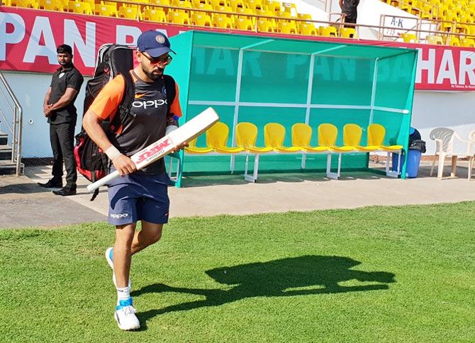 India captain Virat Kohli walks out for a training session on Wednesday
