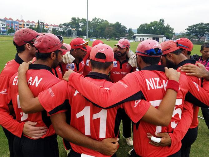 Hong Kong players in a huddle before the match