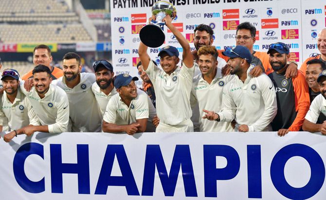 Virat Kohli and his team-mates celebrate after winning the Test series against the West Indies 2-0. Photograph: PTI