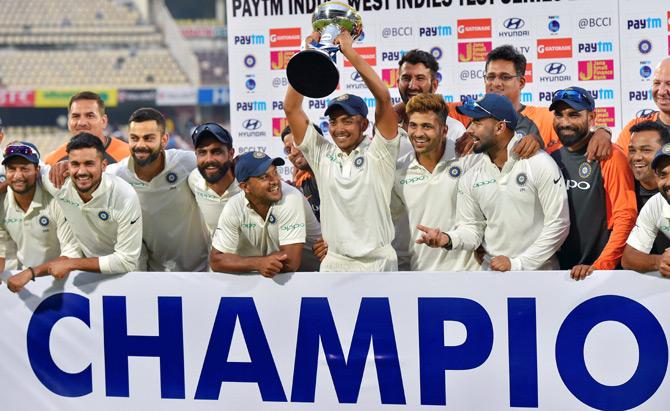 Virat Kohli and his team-mates celebrate after winning the Test series against the West Indies 2-0. Photograph: PTI