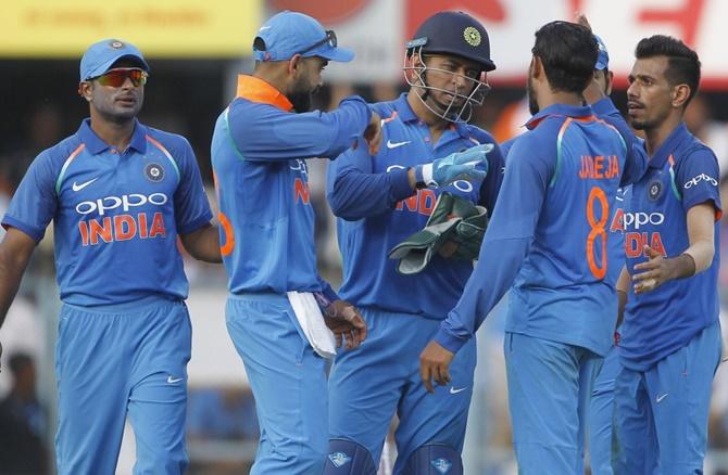 Ravindra Jadeja is congratulated by teammates after dismissing Hetmyer