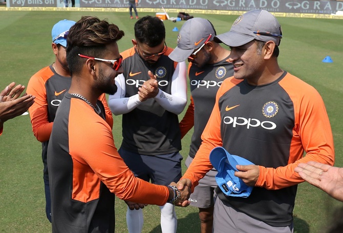 Rishabh Pant is presented the India cap by Mahendra Singh Dhoni