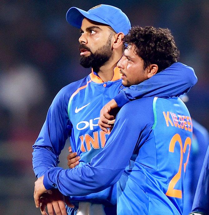 Kuldeep Yadav and Virat Kohli celebrate after dismissing Marlon Samuels in the tied game at Vishakapatnam, October 24, 2018. Photograph: Swapan Mahapatra/PTI