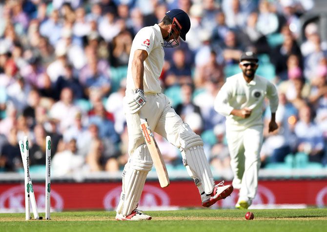 Alastair Cook reacts after being bowled by Jasprit Bumrah after his knock of 71