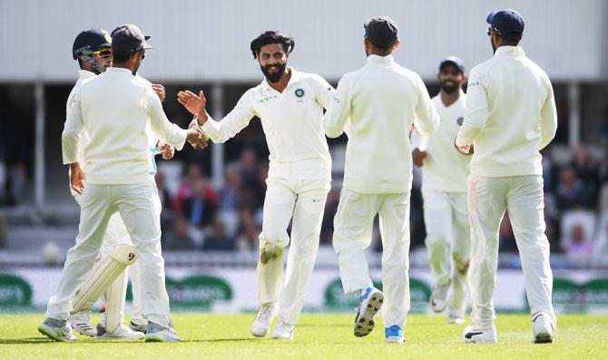 Ravindra Jadeja celebrates with teammates after dismissing Keaton Jennings