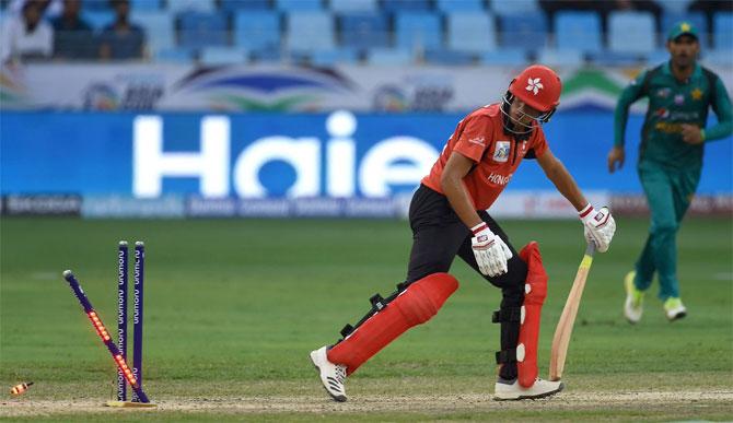 A Hong Kong batsman is bowled by Pakistan bowler Usman Khan