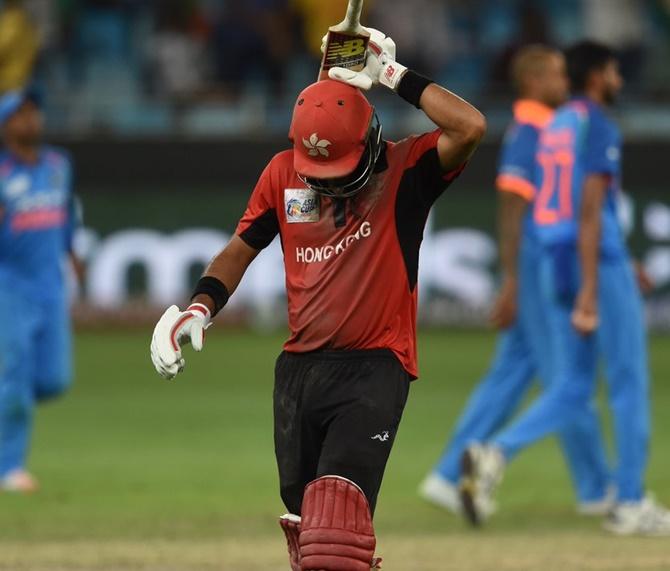 Shikhar Dhawan celebrates on completing his century against Hong Kong on Tuesday