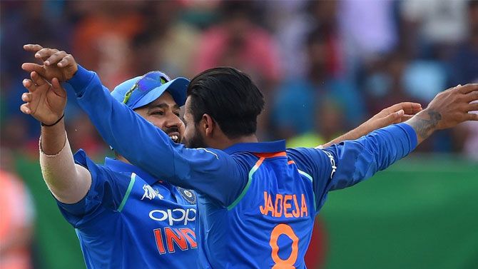 India captain Rohit Sharma and Ravindra Jadeja celebrate on claiming a wicket