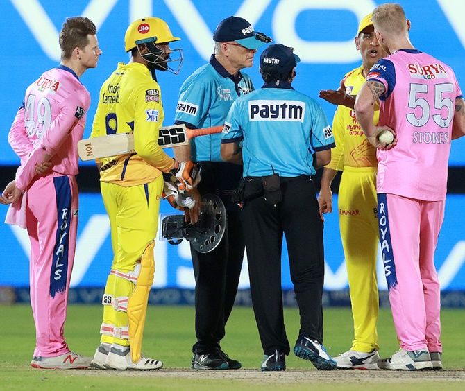 Chennai Super Kings captain Mahendra Singh Dhoni speaks to the umpires and Rajasthan Royals pacer Ben Stokes. Dhoni entered the field of play for an angry confrontation with umpire Ulhas Gandhe, who backtracked after signalling a no ball after Rajasthan pacer Ben Stokes bowled a high-full toss to Mitchell Santner during an IPL match on Thursday, April 11