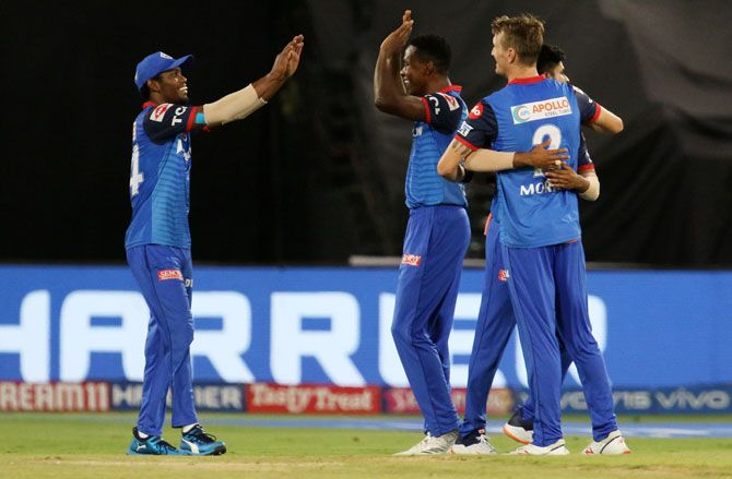 Delhi Capitals' Chris Morris, Kaggiso Rabada and Keemo Paul celebrates the wicket of Sunrisers Hyderabad's Rashid Khan 