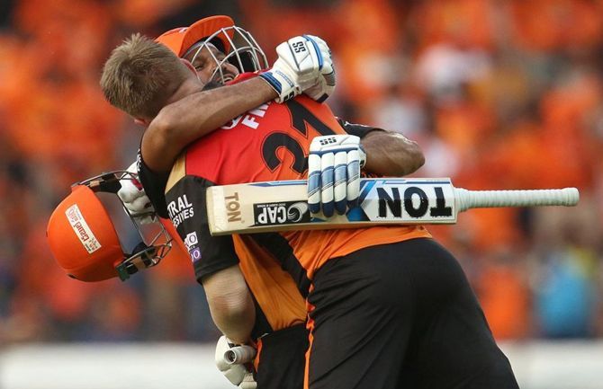 Yusuf Pathan of Sunrisers Hyderabad hugs David Warner after his century during a match in IPL-12.