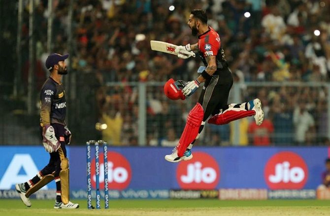 Royal Challengers Bangalore's Virat Kohli launches into a celebratory run after completing his hundred during Friday's IPL match against Kolkata Knight Riders, in Kolkata on April 19