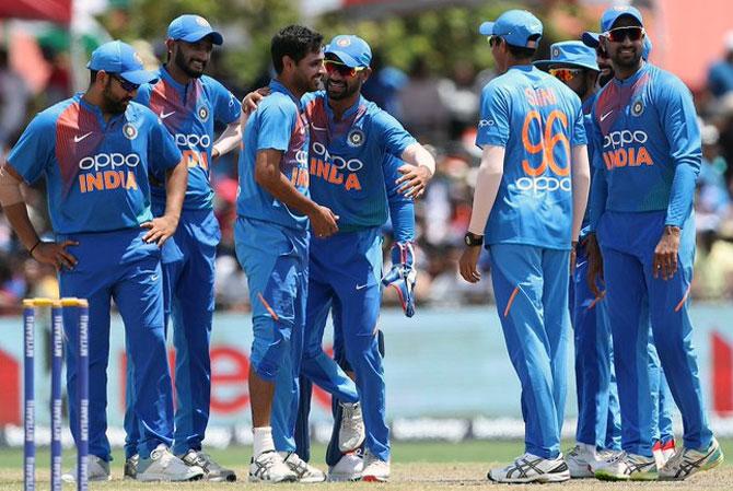 India's players celebrate the dismissal of Evin Lewis