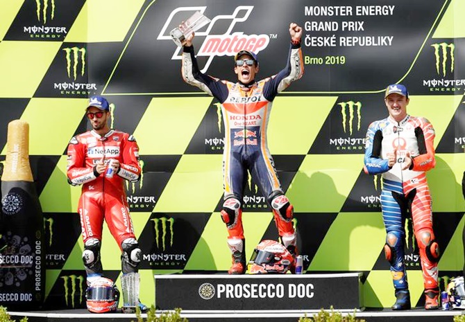 Repsol Honda's Marc Marquez, Ducati Team's Andrea Dovizioso and Pramac Racing's Jack Miller celebrate on the podium after finishing first, second and third respectively in Sunday's Czech Republic Moto GP in Brno
