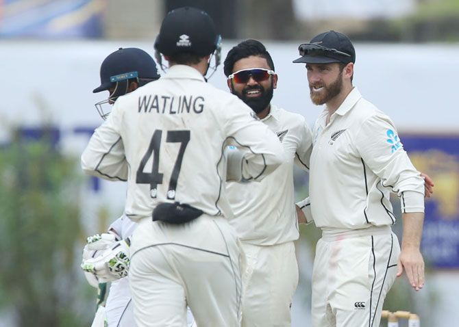 New Zealand bowler Ajaz Patel( 2nd from right) and caption Kane Williamson (right) celebrate with teammates after dismissing Sri Lankan batsman Lahiru Thirimanne 