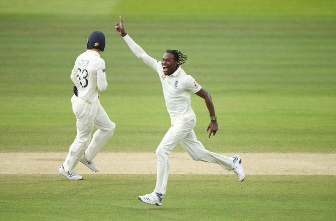 England's Jofra Archer celebrates after taking the wicket of Australia's Usman Khawaja