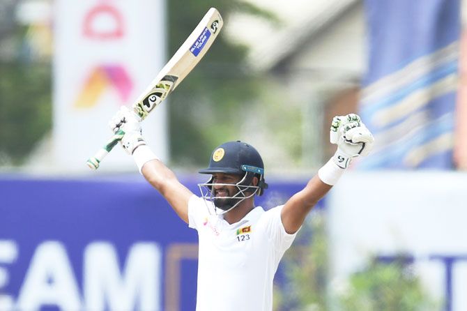 Sri Lanka captain Dimuth Karunaratne celebrates after reaching his century on Day 5 of the first Test against New Zealand at Galle International Stadium in Galle, Sri Lanka, on Sunday