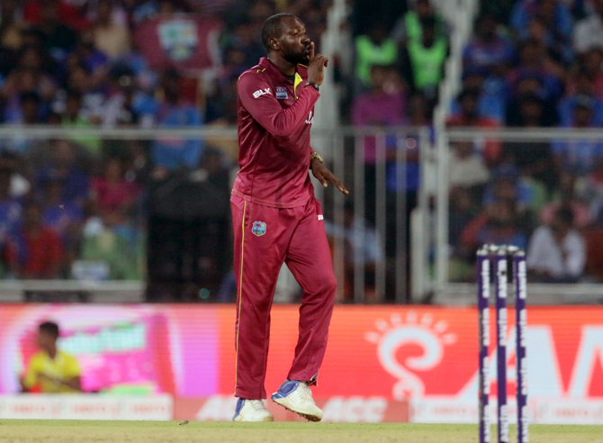 Kesrick Williams celebrates after dismissing Virat Kohli