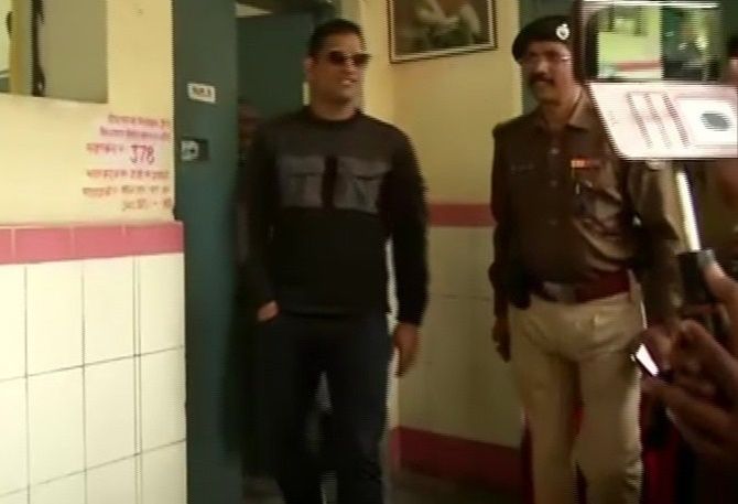 Mahendra Singh Dhoni snapped walking out of the polling booth