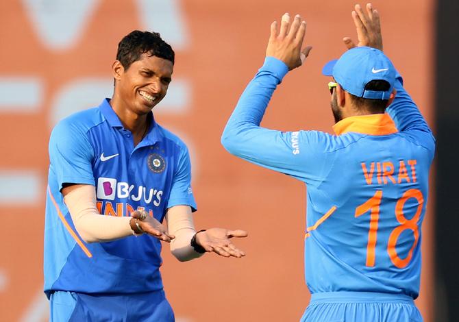 Navdeep Saini celebrates with Virat Kohli on dismissing Shimron Hethmyer