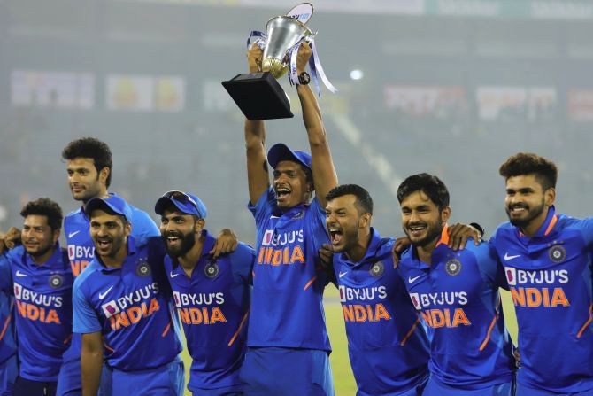 India players celebrate with the trophy after winning the three-match ODI series against West Indies in Cuttack on Sunday
