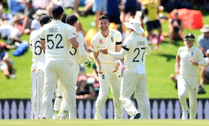 England bowler James Anderson celebrates after taking the wicket of Dean Elgar with the first ball of the match at SuperSport Park in Pretoria on Thursday