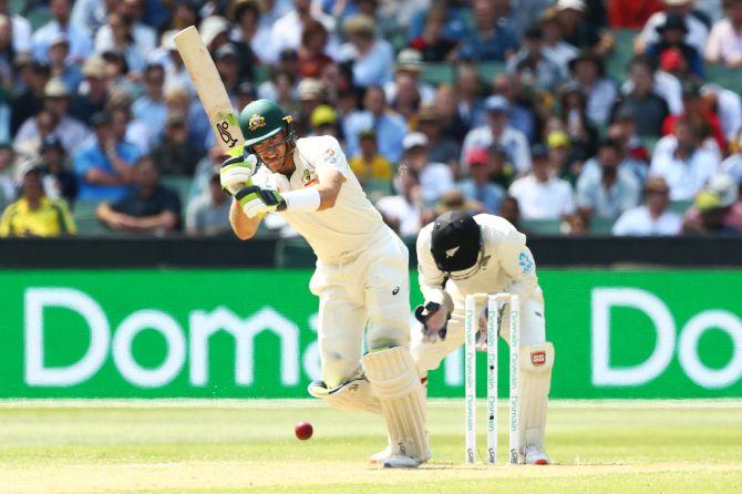 Australia's Tim Paine bats en route his half century