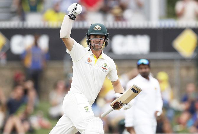 Travis Head celebrates after completing his century against Sri Lanka on Thursday