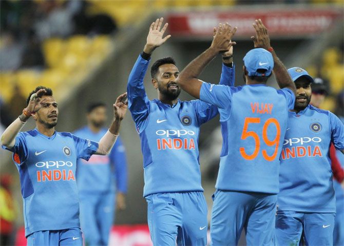 India's players celebrate the wicket of New Zealand's Colin Munro during the first T20I on Wednesday