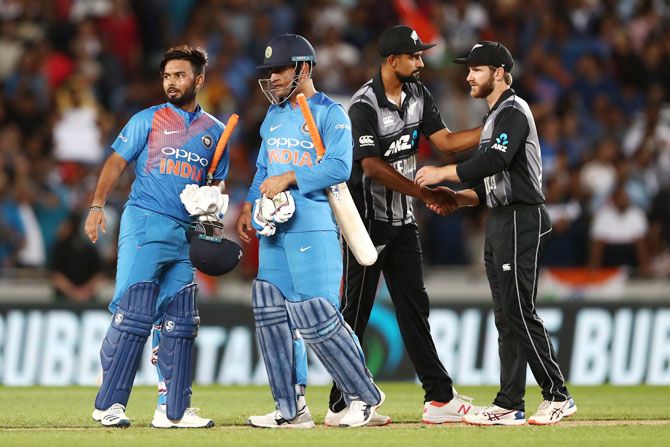 India's Rishabh Pant and MS Dhoni celebrate after their victory