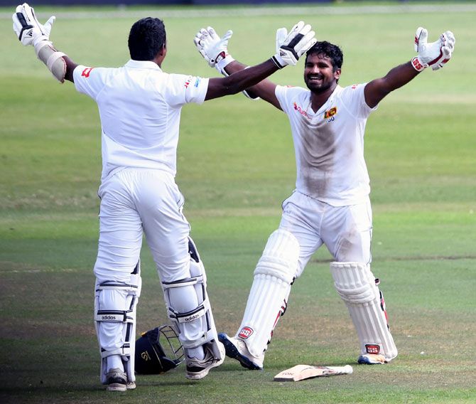 Kusal Perera, right, and Vishwa Fernando celebrate Sri Lanka's one-wicket victory in the first Test against South Africa at Kingsmead stadium on Saturday