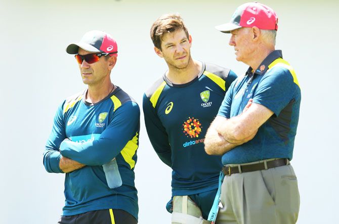 (Left-Right) Australia coach Justin Langer, captain Tim Paine and Australia selector Greg Chappell look on during an Australian nets session at the Sydney Cricket Ground in Sydney on Wednesday