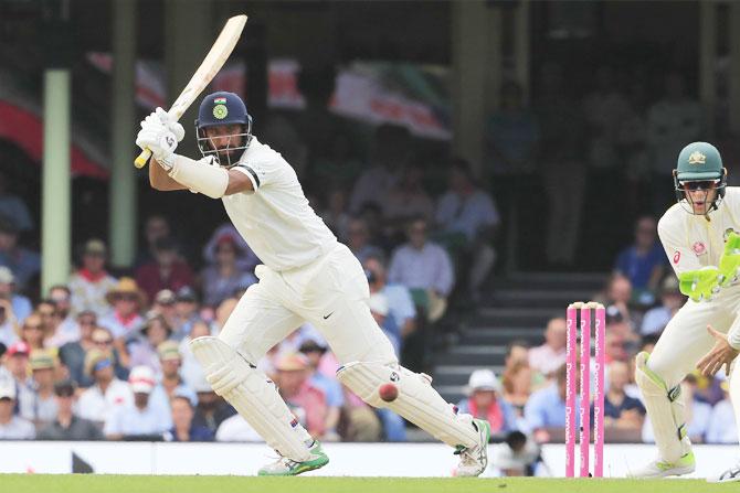  India's Cheteshwar Pujara bats en route his 18th Test ton on Day 1 of the 4th Test against Australia at Sydney Cricket Ground