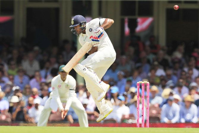 Mayank Agarwal takes evasive action as he tries to fend off a short ball during his innings on Day 1 of the 4th Test in Sydney on Thursday