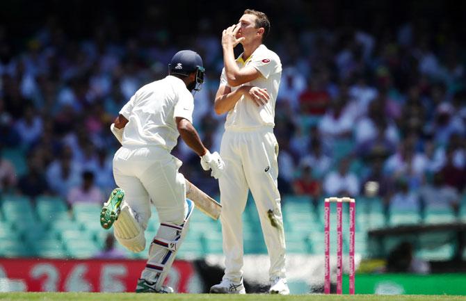 Australia's Josh Hazlewood reacts as Cheteshwar Pujara creams his for runs on Day 2 of the 4th Test at Sydney Cricket Ground in Sydney, Australia, on Friday