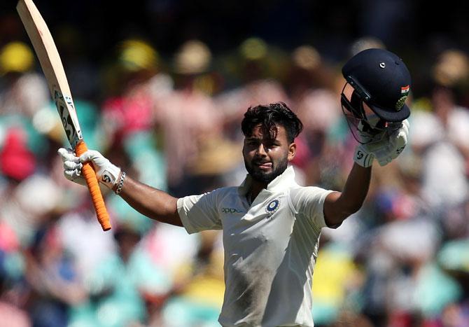 Rishabh Pant celebrates after completing his century against Australia on Friday