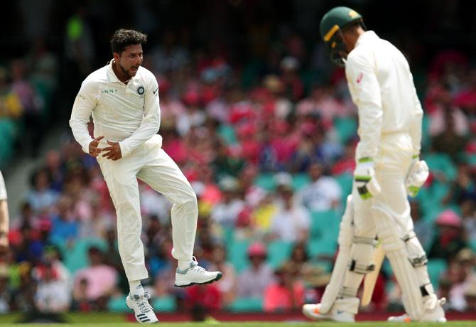  Kuldeep Yadav, left, celebrates after dismissing Usman Khawaja. Photograph: Cameron Spencer/Getty Images