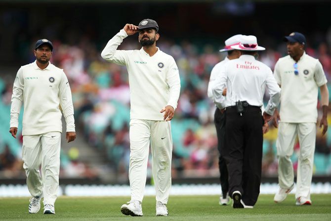 India captain Virat Kohli reacts after umpires take early tea due to bad light.