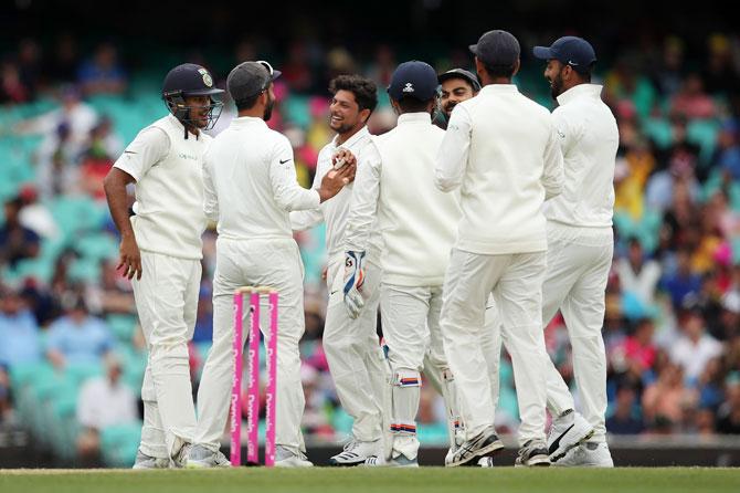 India's Kuldeep Yadav celebrates after trapping Australia's Nathan Lyon LBW